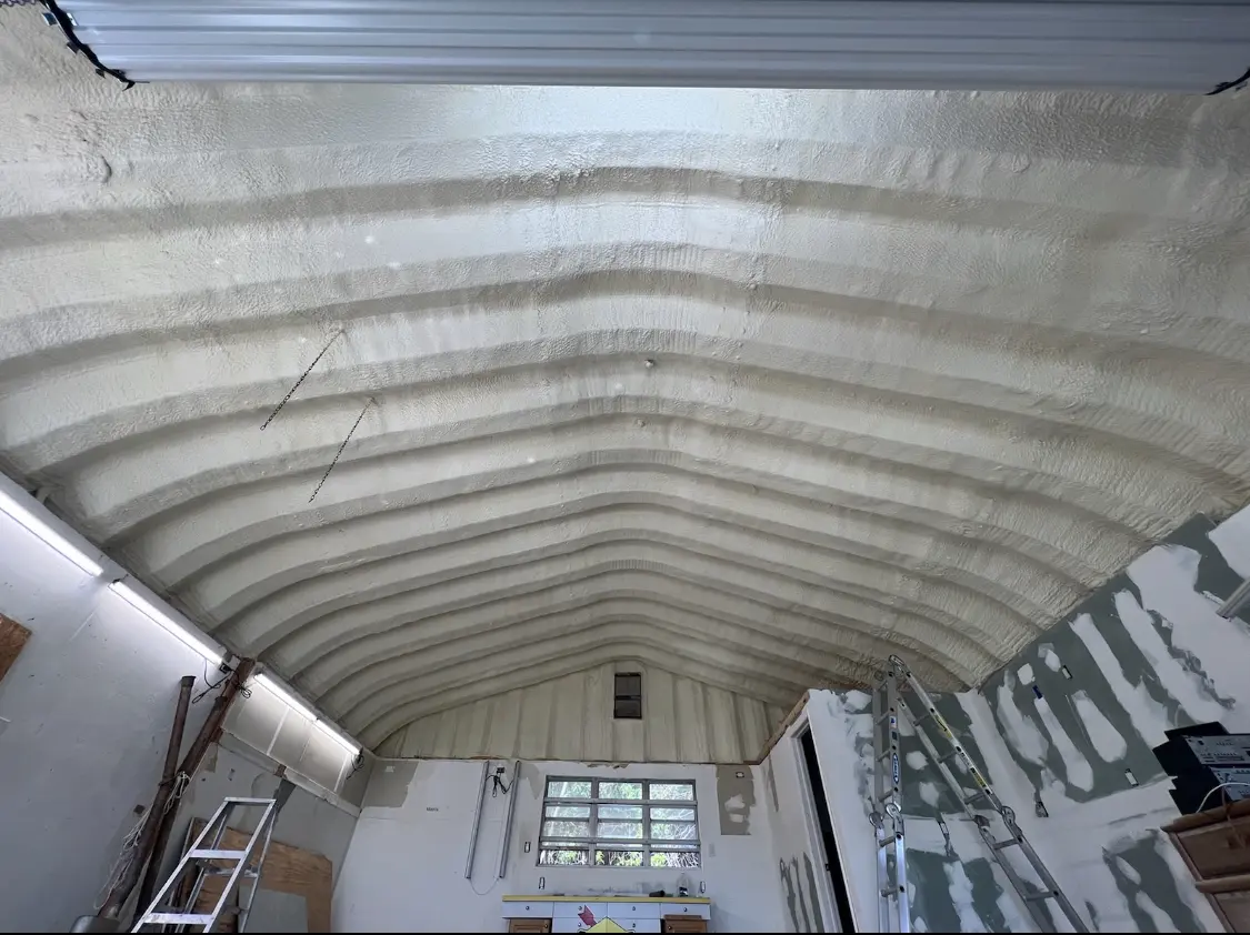 Spray polyurethane foam applied to the underside of a metal roof deck in Woodinville